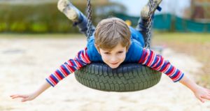 autism-resources-kid-playing-on-tire-swing