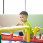 little boy at indoor gym